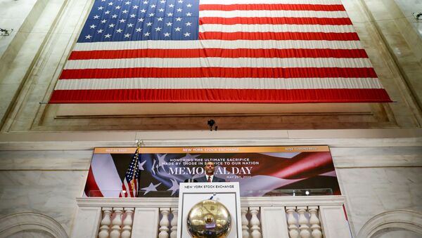 A staff member rings closing bell in honor of Memorial Day and the lives lost in military service to the U.S., as preparations are made for the return to trading, on the floor at the New York Stock Exchange (NYSE) in New York, U.S., May 22, 2020. - Sputnik International