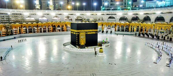 Muslims pray during the Laylat al-Qadr, or Night of Power, the holiest night for Muslims, while practicing social distancing, following the outbreak of the coronavirus disease (COVID-19), during the fasting month of Ramadan, at the Grand Mosque in Mecca, Saudi Arabia May 19, 2020.  - Sputnik International