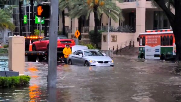 Traffic navigate flood waters in Miami, Florida, U.S. May 25, 2020, in this still image obtained from a social media video. Courtesy of Ryan Rea/Social Media via REUTERS. ATTENTION EDITORS - THIS IMAGE HAS BEEN SUPPLIED BY A THIRD PARTY. MANDATORY CREDIT RYAN REA. NO RESALES. NO ARCHIVES. - Sputnik International