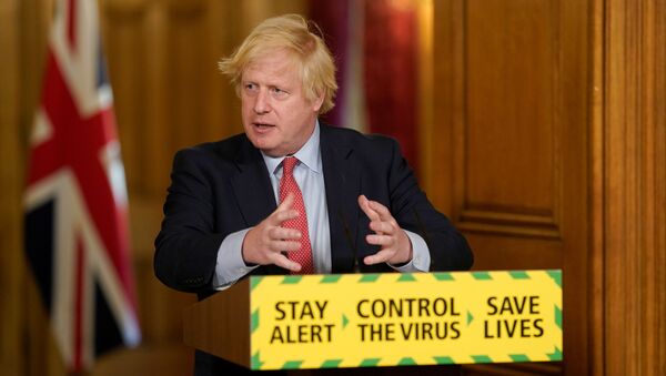 Britain's Prime Minister Boris Johnson holds a daily news conference with Public Health England's (PHE) Medical Director Yvonne Doyle (not pictured), on the coronavirus disease (COVID-19) outbreak, at 10 Downing Street in London, Britain May 25, 2020 - Sputnik International