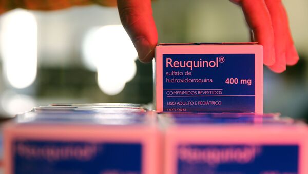 A health worker holds a box of hydroxychloroquine at the pharmacy of the Nossa Senhora da Conceicao hospital, amid the coronavirus disease (COVID-19) outbreak in Porto Alegre, Brazil, May 26, 2020 - Sputnik International