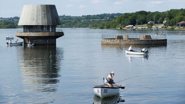 People are seen fishing from boats at Bewl Water Country Park, following the outbreak of the coronavirus disease (COVID-19), Wadhurst, Britain, May 27, 2020.  - Sputnik International