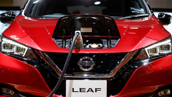 A charging cable is attached to a Nissan Leaf electric car at the Tokyo Motor Show, in Tokyo, Japan October 24, 2019.  - Sputnik International