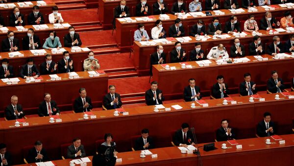 Chinese President Xi Jinping and other officials applaud after the vote on the national security legislation for Hong Kong Special Administrative Region at the closing session of the National People's Congress (NPC) at the Great Hall of the People in Beijing, China May 28, 2020. - Sputnik International