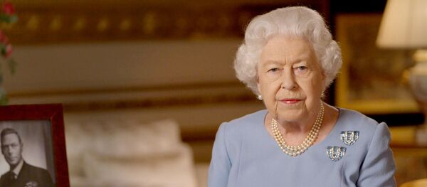Britain's Queen Elizabeth II delivers an address to the nation and the Commonwealth on the 75th anniversary of VE Day at Windsor Castle, Britain, in this Buckingham Palace handout image released May 8, 2020 - Sputnik International