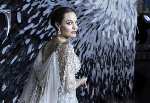 Actress Angelina Jolie poses for photographers on arrival at the European premiere of the film 'Maleficent Mistress of Evil' in central London on Wednesday, Oct. 9, 2019.  - Sputnik International