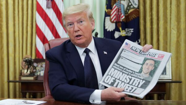 U.S. President Donald Trump holds up a front page of the New York Post as he speaks to reporters while signing an executive order on social media companies in the Oval Office of the White House in Washington, U.S., May 28, 2020. - Sputnik International