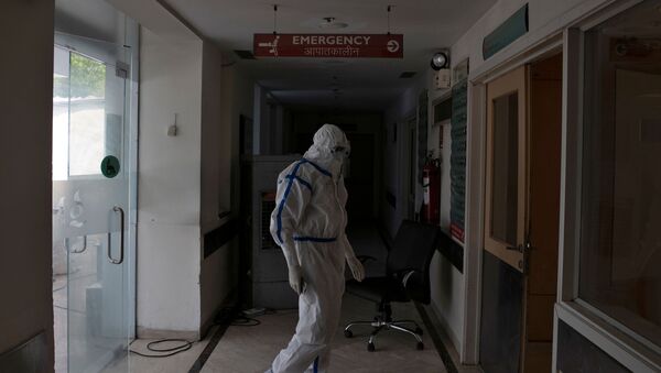 A medical worker stands outside the emergency ward for patients suffering from the coronavirus disease (COVID-19) at Max Smart Super Speciality Hospital in New Delhi - Sputnik International