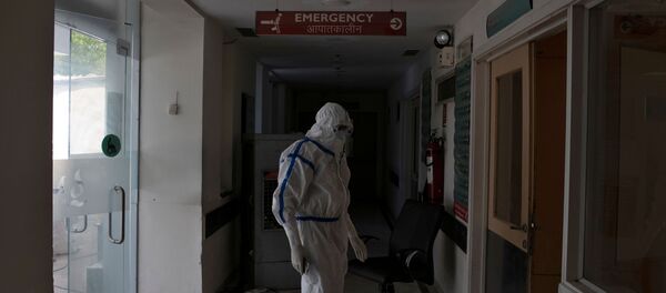 A medical worker stands outside the emergency ward for patients suffering from the coronavirus disease (COVID-19) at Max Smart Super Speciality Hospital in New Delhi A medical worker stands outside the emergency ward for patients suffering from the coronavirus disease (COVID-19) at Max Smart Super Speciality Hospital in New Delhi - Sputnik International