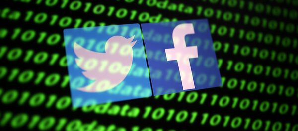  The Twitter and Facebook logo along with binary cyber codes are seen in this illustration taken November 26, 2019 - Sputnik International