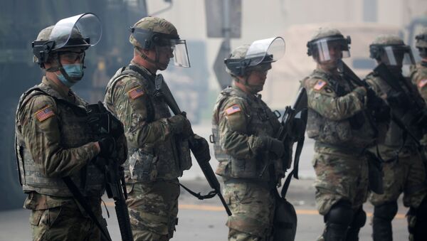 National Guard members guard the area in the aftermath of a protest after a white police officer was caught on a bystander's video pressing his knee into the neck of African-American man George Floyd, who later died at a hospital. File photo  - Sputnik International