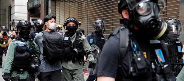 Riot police officers detain an anti-government demonstrator during a protest at Central District against the second reading of a controversial national anthem law in Hong Kong, China May 27, 2020. REUTERS Riot police officers detain an anti-government demonstrator during a protest at Central District against the second reading of a controversial national anthem law in Hong Kong, China May 27, 2020. REUTERS - Sputnik International