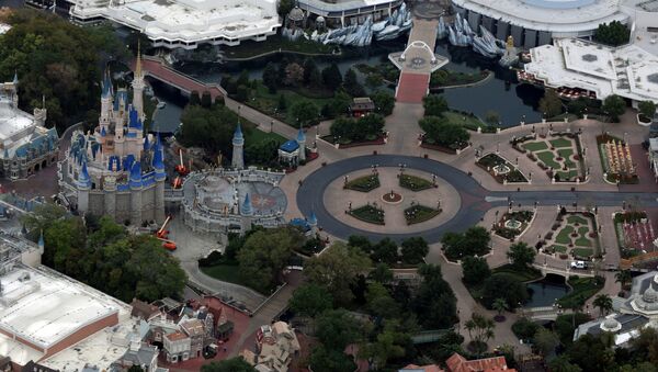 Disney's Magic Kingdom theme park is seen empty of visitors after it closed in an effort to combat the spread of coronavirus disease (COVID-19), in an aerial view in Orlando, Florida, U.S. March 16, 2020. - Sputnik International