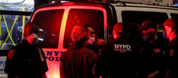 Police officers detain a protester during a protest following the death of African-American George Floyd who was seen in graphic video footage gasping for breath as a Minneapolis Police officer knelt on his neck, in the Brooklyn borough of New York City, U.S., May 29, 2020. - Sputnik International