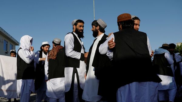 Newly freed Taliban prisoners greet each other at Pul-i-Charkhi prison, in Kabul - Sputnik International