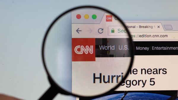 CNN logo on a computer screen with a magnifying glass - Sputnik International