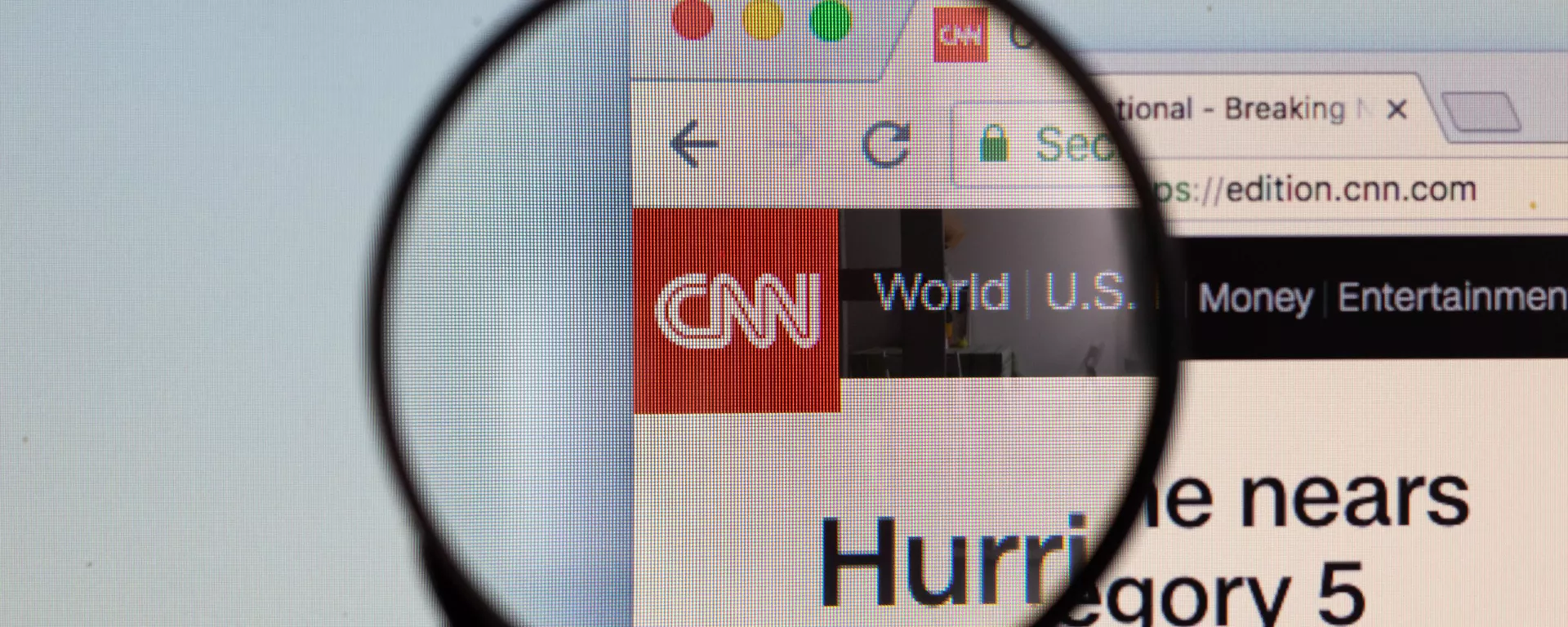 CNN logo on a computer screen with a magnifying glass - Sputnik International, 1920, 26.12.2024