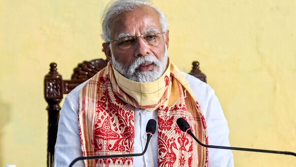 In this handout photograph taken on May 22, 2020 and released by the Indian Press Information Bureau (PIB), India's Prime Minister Narendra Modi speaks during a review meeting with officials after his aerial survey of affected areas in the state from cyclone Amphan, in Basirhat, West Bengal.  - Sputnik International