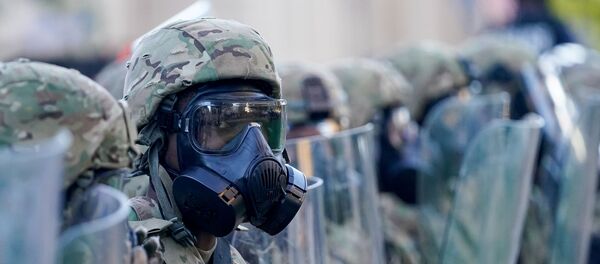 A soldier with the Army National Guard stand on the street during a protest against the deaths of Breonna Taylor by Louisville police and George Floyd by Minneapolis police, in Louisville, Kentucky, U.S. May 31, 2020 - Sputnik International