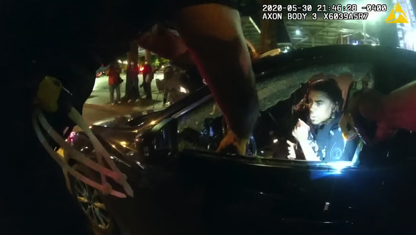 This is one officer's body camera footage released by the Atlanta Police Department showing the incident where two students were tased and pulled from their car in Downtown on May 30 during the George Floyd protests.  - Sputnik International