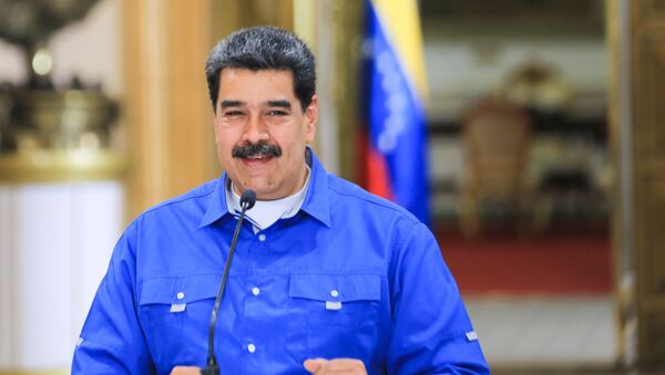 Handout picture released by Venezuelan Presidency showing Venezuelan President Nicolas Maduro speaking during a video conference meeting with members of his cabinet, at Miraflores Presidential Palace in Caracas, on June 1, 2020 - Sputnik International