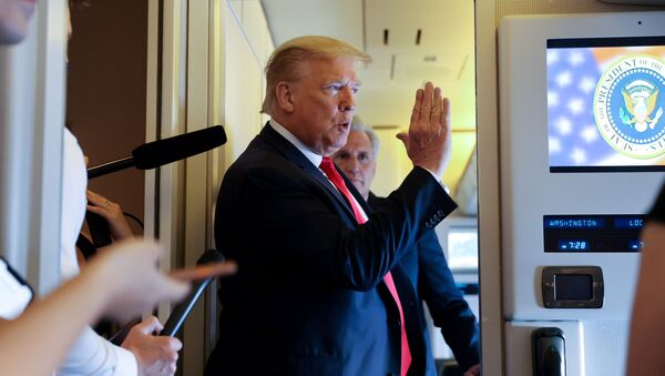 U.S. President Donald Trump speaks to reporters aboard Air Force One while returning to Washington from Cape Canaveral, Florida, U.S. May 30, 2020 - Sputnik International