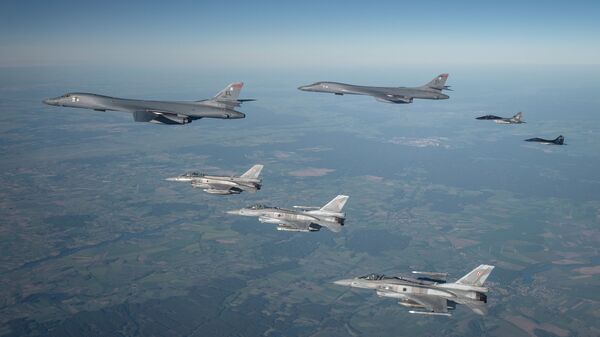 Polish F-16s and MiG-29s escort a B1B Lancer during a training mission for Bomber Task Force Europe, May 29, 2020. - Sputnik International
