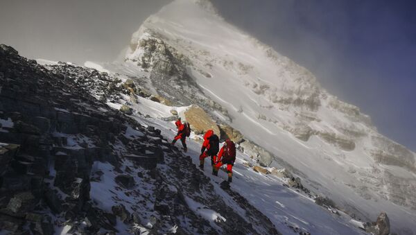 In this photo released by Xinhua News Agency, members of a Chinese surveying team head for the summit of Mount Everest, also known locally as Mt. Qomolangma, Wednesday, May 27, 2020. The Chinese government-backed team plans to summit Mount Everest this week at a time when the world's tallest peak has been closed to commercial climbers.  - Sputnik International