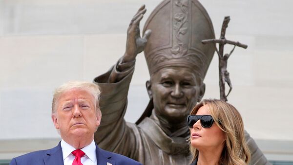 U.S. President Donald Trump and first lady Melania Trump pose during a visit to the Saint John Paul II National Shrine in Washington, U.S., June 2, 2020 - Sputnik International