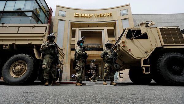 National Guard's members are seen in front of the Dolby Theatre along Hollywood Boulevard during a rally against George Floyd death in Minneapolis police custody, in Los Angeles, California, U.S., June 2, 2020 - Sputnik International