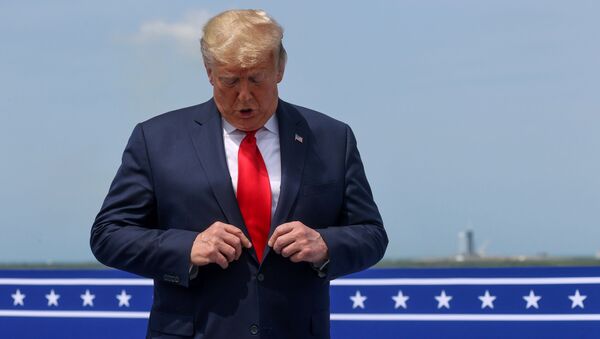 U.S. President Donald Trump checks his tie as he talks to reporters after watching the launch of a SpaceX Falcon 9 rocket and Crew Dragon spacecraft on NASA's SpaceX Demo-2 mission to the International Space Station from NASA's Kennedy Space Center in Cape Canaveral, Florida, U.S.  May 30, 2020. - Sputnik International