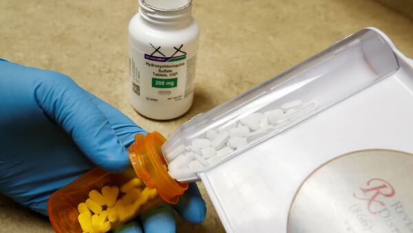 The drug hydroxychloroquine, pushed by U.S. President Donald Trump and others in recent months as a possible treatment to people infected with the coronavirus disease (COVID-19), is displayed by a pharmacist at the Rock Canyon Pharmacy in Provo, Utah, U.S., May 27, 2020 - Sputnik International