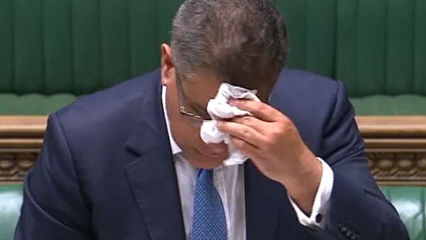 A video grab from footage broadcast by the UK Parliament's Parliamentary Recording Unit (PRU) shows Britain's Business Secretary Alok Sharma wiping his brow as he makes a statement in the House of Commons in London on June 3, 2020, as lockdown measures ease during the novel coronavirus COVID-19 pandemic - Sputnik International