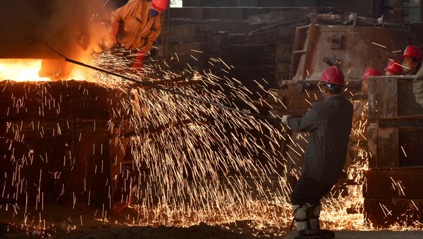 This photo taken on March 15, 2020 shows workers pouring molten steel at a foundry in Wuyi, China's eastern Zhejiang province - Sputnik International