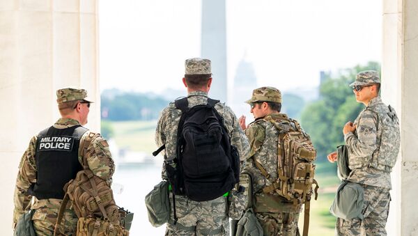 Members of the DC National Guard gear-up after a short rest from standing guard at the Lincoln Memorial during protests in DC over the death of George Floyd, in Washington, D.C., U.S., June 4, 2020 - Sputnik International