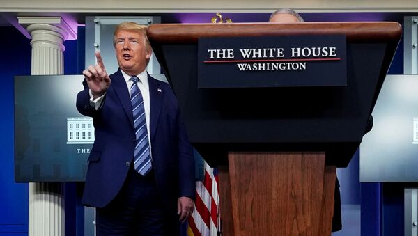 U.S. President Donald Trump stops a reporter from asking Dr. Anthony Fauci a question about use of the drug hydroxychloroquine to treat the disease caused by the new coronavirus near the end of the daily coronavirus task force briefing at the White House in Washington, U.S., April 5, 2020 - Sputnik International