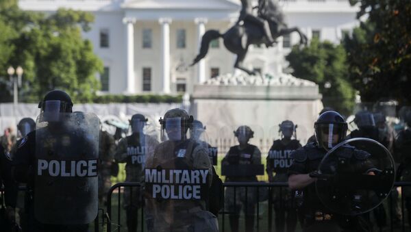 DC National Guard military police officers look on as demonstrators rally near the White House against the death in Minneapolis police custody of George Floyd, in Washington, D.C., U.S., June 1, 2020 - Sputnik International