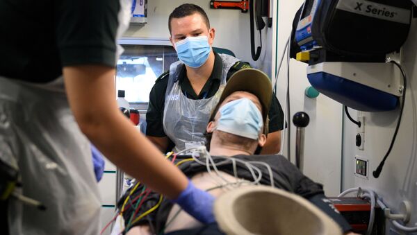 Paramedic James Hansford looks on during the treatment of a patient who has previously tested positive for the coronavirus disease (COVID-19), after responding to a 999 call in Portsmouth, Britain May 6, 2020 - Sputnik International