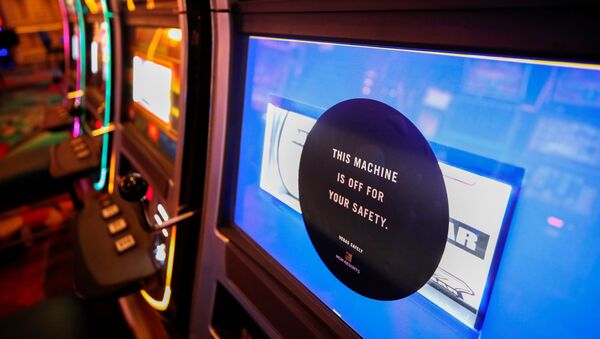A disabled slot machine to ensure social distancing is seen during the reopening of Bellagio hotel-casino, closed since March 16, 2020 as part of steps to slow the spread of the coronavirus disease (COVID-19), in Las Vegas, Nevada, U.S. June 4, 2020.  - Sputnik International