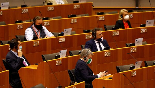 Members of the European Parliament are seen during a plenary session on a new proposal for the EU's joint 2021-27 budget and an accompanying Recovery Instrument to kickstart economic activity in the bloc ravaged by the coronavirus disease (COVID-19) outbreak, in Brussels, Belgium, May 27, 2020. - Sputnik International