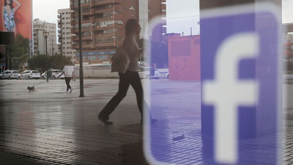  Facebook logo is seen on a shop window in Malaga, Spain, June 4, 2018 - Sputnik International