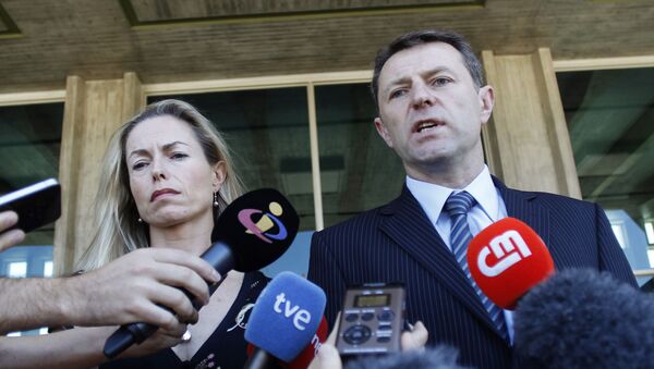 In this 8 July 2014 file photo, Kate McCann, left, and Gerry McCann, the parents of missing British girl Madeleine McCann talk to the media outside a court in Lisbon.  - Sputnik International