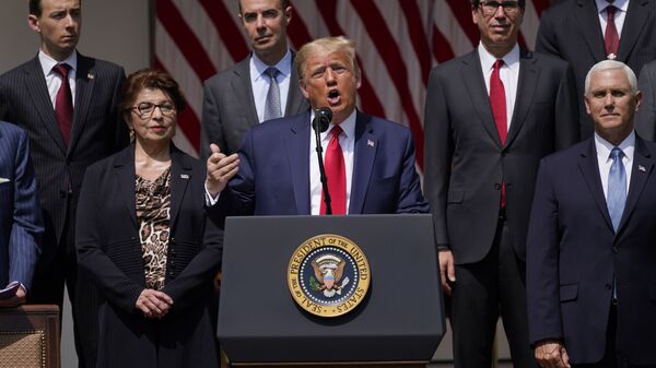 President Donald Trump speaks during a news conference in the Rose Garden of the White House, Friday, June 5, 2020, in Washington. Front row from left, Small Business Administration administrator Jovita Carranza, Trump, and Vice President Mike Pence. Back row from left, member of Council of Economic Advisers Tyler Goodspeed, Labor Secretary Eugene Scalia, Treasury Secretary Steven Mnuchin, and Chairman of the Council of Economic Advisers Tomas Philipson.(AP Photo/Evan Vucci) - Sputnik International
