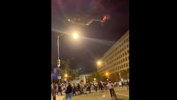 A National Guard UH-72 Lakota helicopter is seen hovering just feet above the heads of protesters in Washington, DC, on June 1, 2020 - Sputnik International