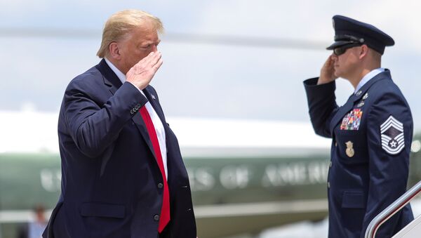U.S. President Donald Trump returns a salute while boarding Air Force One as he departs Washington for travel to Guilford, Maine at Jont Base Andrews, Maryland, U.S., June 5, 2020. - Sputnik International
