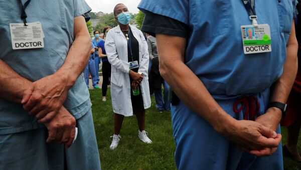 Nurses, doctors and hospital workers take part in a vigil at Brigham and Women’s Hospital, where many coronavirus disease (COVID-19) patients have been treated, against the death in Minneapolis police custody of George Floyd, in Boston, Massachusetts, U.S., June 5, 2020 - Sputnik International