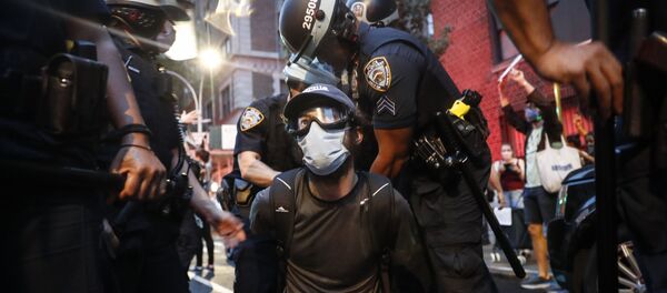 A protester is arrested by New York Police Department officers on Park Avenue after violating curfew, Friday, June 5, 2020, in New York. - Sputnik International