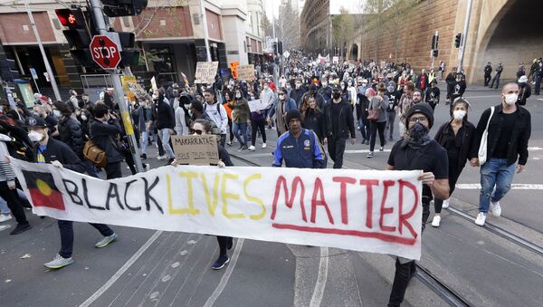 Protestors march in Sydney, Saturday, June 6, 2020, to support the cause of U.S. protests over the death of George Floyd. Black Lives Matter protests across Australia proceeded mostly peacefully as thousands of demonstrators in state capitals honored the memory of Floyd and protested the deaths of indigenous Australians in custody. - Sputnik International