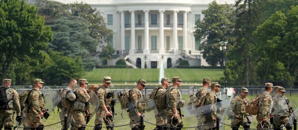 Uniformed military personnel walk in front of the White House ahead of a protest against racial inequality in the aftermath of the death in Minneapolis police custody of George Floyd, in Washington, U.S. June 6, 2020 - Sputnik International