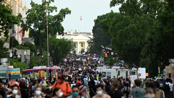 Demonstrators march on 16th St. near the White House, during a protest against racial inequality in the aftermath of the death in Minneapolis police custody of George Floyd, in Washington, U.S. June 6, 2020 - Sputnik International